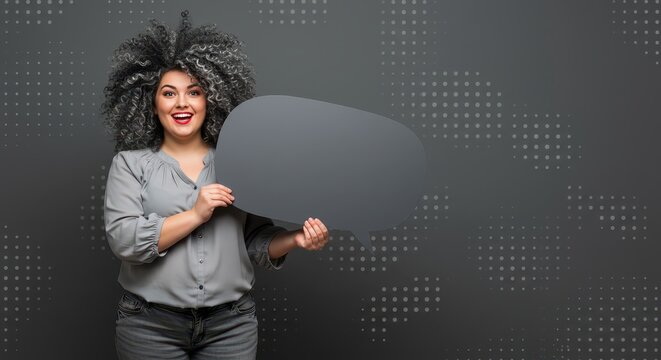 The woman is holding a large white speech bubble. Visual Concept.