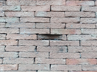 Brick wall creates rustic and strong feeling, with its textured surface providing solid and dependable construction