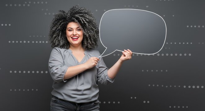 The woman is holding a large white speech bubble. Visual Concept.