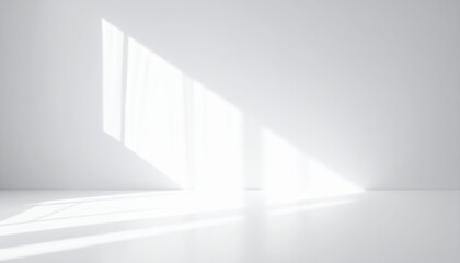 Obraz premium Bright, airy white room featuring soft natural light streaming through a large window, illuminating minimalist decor and creating a serene atmosphere.