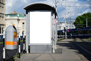 blank poster sign panel bus shelter. billboard mockup display. white lightbox sign in bus stop. digital panel. city transit station. urban street. park setting. outdoor advertising