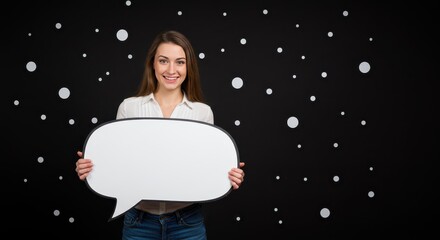 The woman is holding a large white speech bubble. Visual Concept.