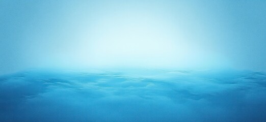 Fototapeta premium calm and misty ocean surface under soft blue light with gentle waves fading into smooth horizon