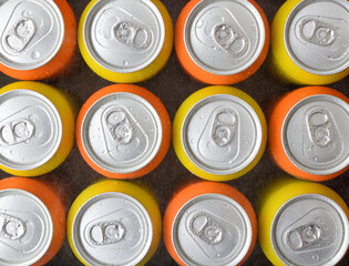 Pattern of fresh orange and yellow drink cans