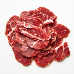 A pile of thinly sliced cured meat
