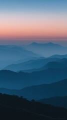 Fototapeta premium Serene Misty Mountains at Dawn with Gradients of Color Reflecting a Tranquil Morning in a Breathtaking Natural Landscape Scene