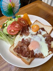 Fried egg and bacon on Toast.