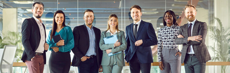 Group portrait of happy smiling diverse colleague, businesspeople looking at camera, team of...