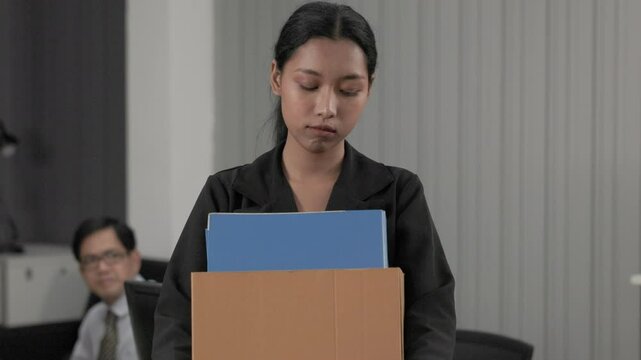 loses job, layoff, fired Unemployed : Sadness depressed young Asian Business woman was fired from job with box cardboard packing personal items after losing jobs
