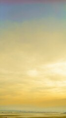 Fototapeta premium Serene Landscape View with Golden Sky and Soft Clouds Captured During Sunset in Rural Area Evoking Calmness and Tranquility for Nature Lovers