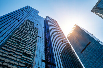 The glass exterior wall of the skyscraper in the financial center