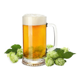 Fresh beer in glass mug and hop flowers on white background