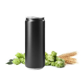 Fresh beer in can with hop flowers and ears of wheat on white background