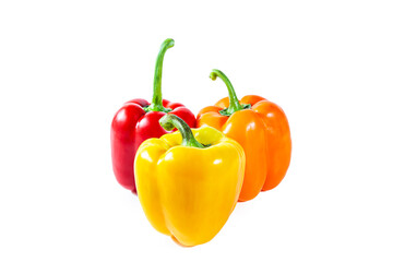 Fresh juicy shiny red, yellow and orange bell peppers. Isolated on white.