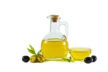 Extra virgin olive oil in a transparent jug and black and green olives with leaves.