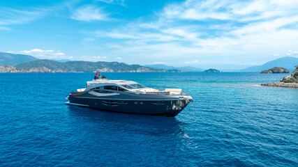 Luxury Yacht Captured by Drone in Calm Blue Waters

