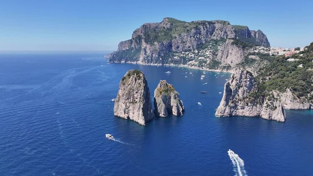 Faraglioni Island At Capri In Naples Italy. Beach Landscape. Giant Cliffs Scene. Faraglioni Island At Capri In Naples Italy. Gulf Of Naples Skyline. Mediterranean Sea Coast. Scenic Capri Island.