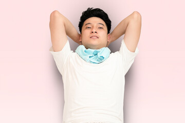 young man doing push up in pink background