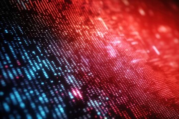 Close-up of illuminated digital binary code in blue and red colors on a dark background representing data and technology
