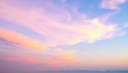 Fototapeta premium A clear, vibrant blue sky stretches overhead, dotted with a few fluffy white clouds, creating a serene and uplifting atmosphere.
