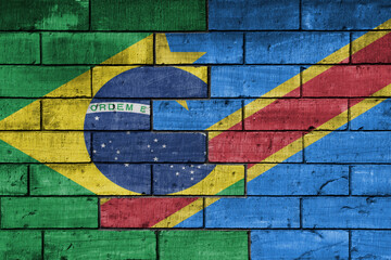 colourful painted big national flag of democratic republic of the congo and flag of brazil on a massive old brick wall background. concept