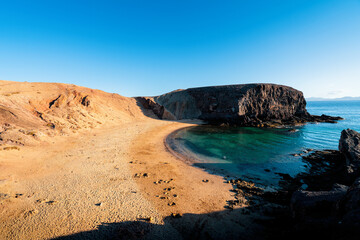 Landscape with turquoise water of the Atlantic Ocean at Papagayo Bay Beach, Lanzarote, Canary...