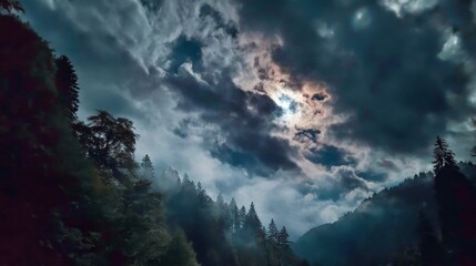 Fototapeta premium Dramatic Cloud Formation Over Mountain Landscape with Dark Shadows and Light Breaking Through Dense Fog
