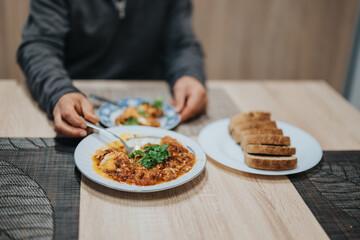 A table setting showcasing a rustic Italian meal, including marinara pasta and slices of artisan bread, being served in a warm, inviting atmosphere perfect for dining and relaxation.