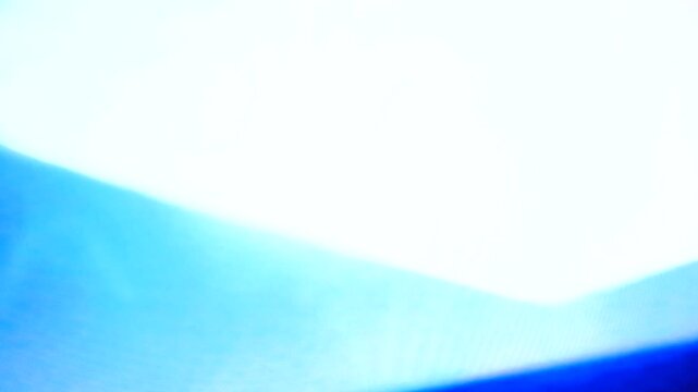 Real analog video looping feedback through a VCR and television. Blue, white and black elements suitable for creative keying. Captured with a 4K camera from VHS tape..