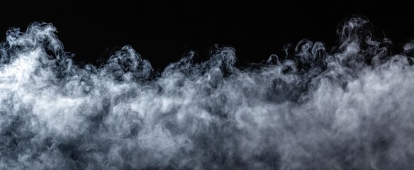 Fototapeta premium The swirling smoke creating an ethereal atmosphere against a dark background.