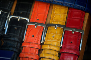 Colorful leather belt in a shop window, italian fashion luxury