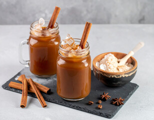 Fototapeta premium Venezuelan chicha drink served in glass jars with cinnamon and crushed ice