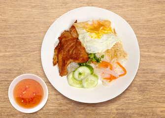 Vietnamese combination broken rice. Cơm Tấm Sườn Bì Chả. Vietnamese Broken Rice is served with grilled pork. Com tam suon bi cha. Broken rice with grilled pork chop, meatloaf and shredded pork skin. 