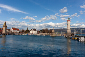 Fototapeta premium This scenic wide-angle shot captures the entrance to the harbor of Lindau, a charming island town on Lake Constance (Bodensee)