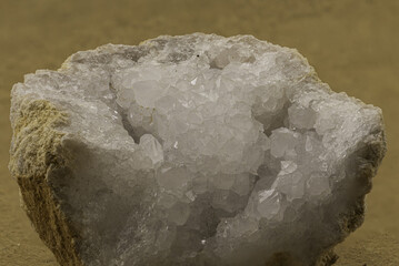 White crystal cluster inside a natural geode formation. Ideal for geology, mineralogy, earth science, or decorative mineral-themed educational and commercial stock use