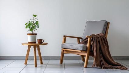Fototapeta premium Interior scene featuring a wooden chair with a blanket and a plant on a small round table near it