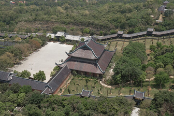 Exploring ancient architecture amidst lush greenery in northern Vietnam during daytime