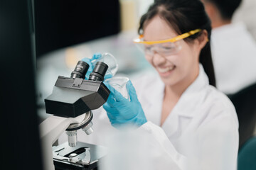 Microscope-focused research in modern laboratory environment, highlighting advancements in medicine...