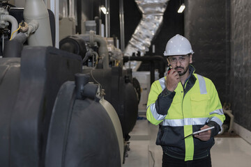Mechanical engineer Checking of centrifugal pump in pump room. worker working in plant room.