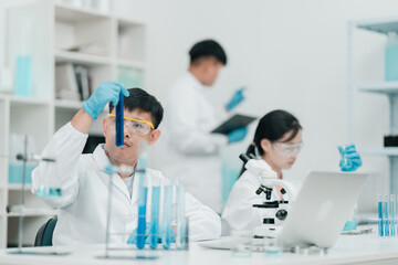 Fototapeta premium Medical research team conducting scientific experiments in a pharmaceutical laboratory, analyzing samples under microscopes to develop innovative medicine and healthcare solutions