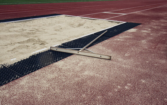 Sand landing field for athletics. Long jump. Traditional athletics discipline. Long jump, triple jump, Technical power athletics discipline. Athletics outdoor stadium.