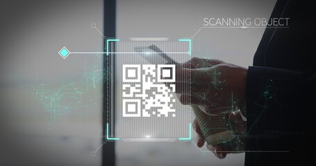 Male wearing dark suit scanning smartphone screen in modern office space, with qr code overlay