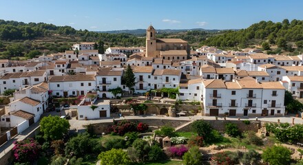 Fototapeta premium Aerial View of White Village in Rural Landscape on Clear Day