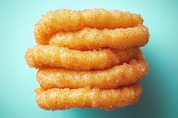 Stack of sugary donuts on blue background