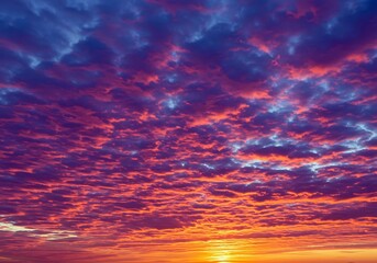 Dramatic sunset sky filled with orange and purple clouds, creating a breathtaking view