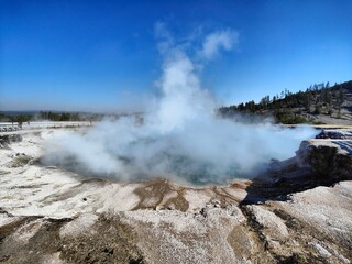 Steaming geysers and hot springs in Yellowstone, Wyoming, USA