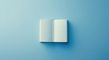 Open Book on Blue Background: Minimalist Composition