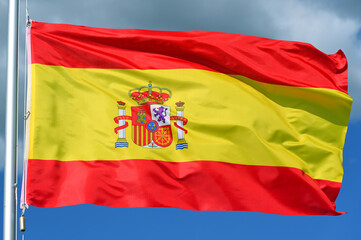 Fototapeta premium Close-up of the national flag of Spain fluttering in the wind, wave pattern