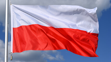 Close-up of the national flag of Poland fluttering in the wind, wave pattern