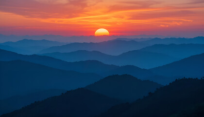 Fototapeta premium Vibrant Sunset Over Layered Mountain Ridges